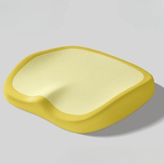 Yellow seat cushion seen at an angle on a plain background