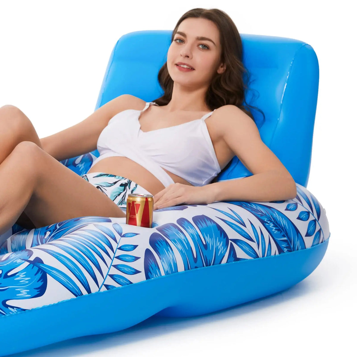 Close-up of the raised backrest and side cup holder with a drink can, woman resting against it