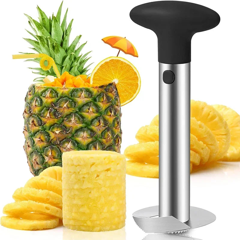Upright corer beside a pineapple served as a drink with paper umbrella, plus rings and a cored cylinder